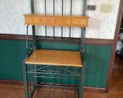 Bakers rack…green metal with wooden shelves. Measures 30” w x 70” tall.  Presale $100