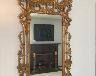 Ornate mirror in gold with Asian or Oriental design.measures 60 h x32” w .