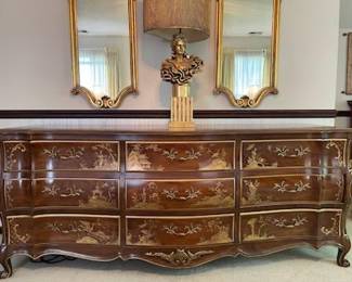 This dresser was made by the White furniture company.  There is an Asian design on the front.  chinoiserie is the style. Measures 80” l x 33” h x 21 d.  Presale $650
