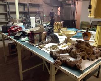 Large wooden lion door knocker, variety of vintage telephones, movie projector with original box, wall sconce