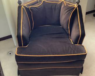 Brown chair with tan piping… measures 28” w x 29” h x 28” d.