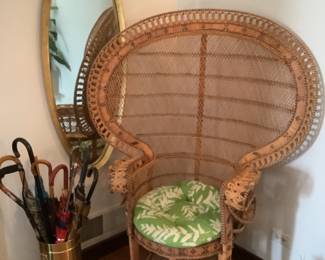Large back vintage wicker chair  ( used in Adam’s family movie) , umbrella holder with vintage umbrellas and oval gold mirror.  Mirror measures 48 x 18.  Presale $85
