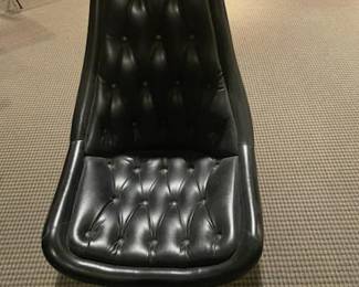 Close up of tufted chair to Star Trek table