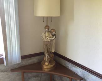Corner table and statue lamp.