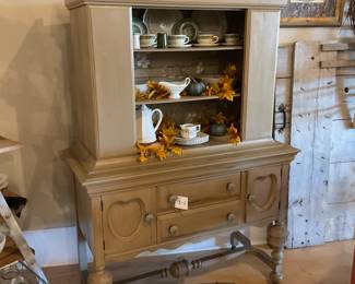 Refinished vintage hutch, stoneware dishes