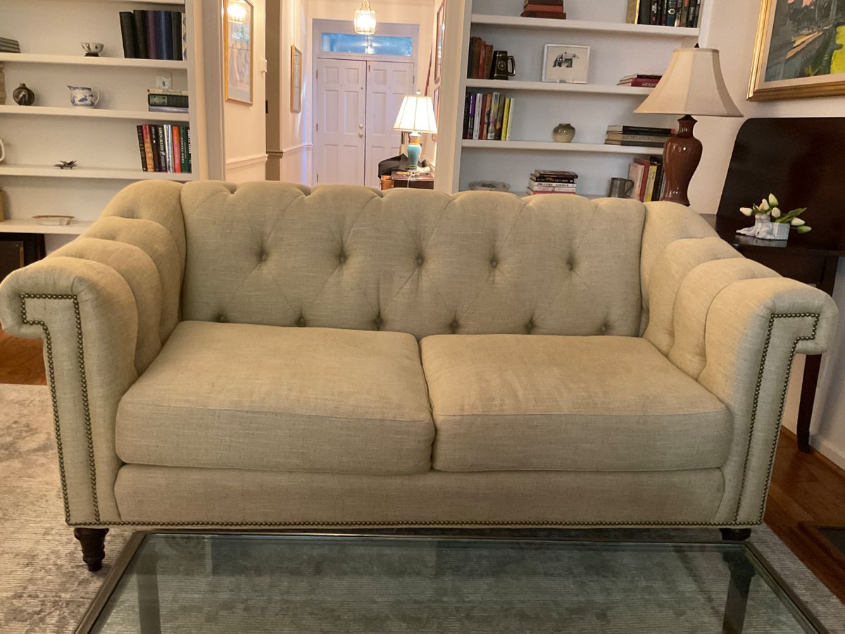 F906  Sherrill Furniture tufted Chesterfield-style sofa, neutral color with brass nailhead trim, turned arms, turned wooden feet. Excellent condition $1000