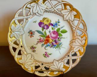 A708. Reticulated porcelain plate with floral center and Gilt ivy design $45