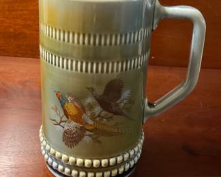 A411 Vintage ceramic beer stein with pheasant design. 6.5”. $10