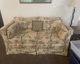 B135. Traditional floral upholstered love seat $50
