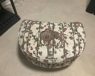 U19. 30”x20”. Upholstered ottoman with elephant and cherub pattern $65