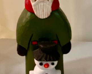 C409. Hand carved J L Mathis Santa with snowman 7” $12