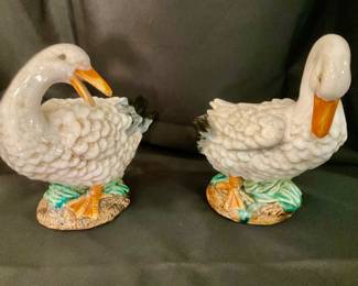 D516 Pair of vintage hand painted ceramic goose figurines; 7x8”. $35