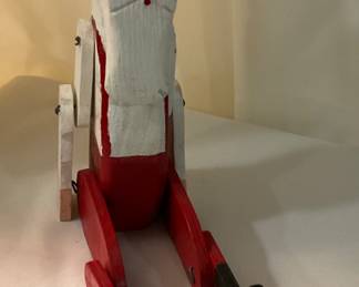 C407 hand carved sitting Santa with dangling legs 9” $10