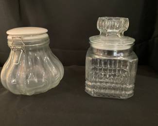 A305. (2) 7” storage jars $5