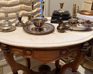 Antique marble top occasional table and silver serving pieces