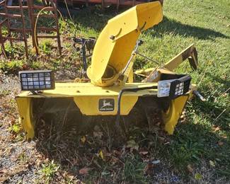 John Deere snow blower attachment.  Come get it for the upcoming winter!