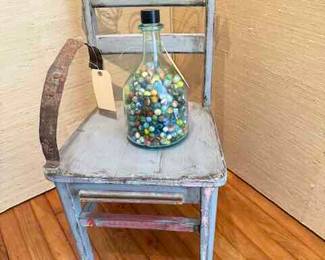 Artist unknown  17" by 32" by 16" 
Jar of Marbles
