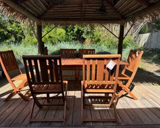 Brand new, ( we unboxed and assembled) eucalyptus wood extending table and 6 folding chairs.