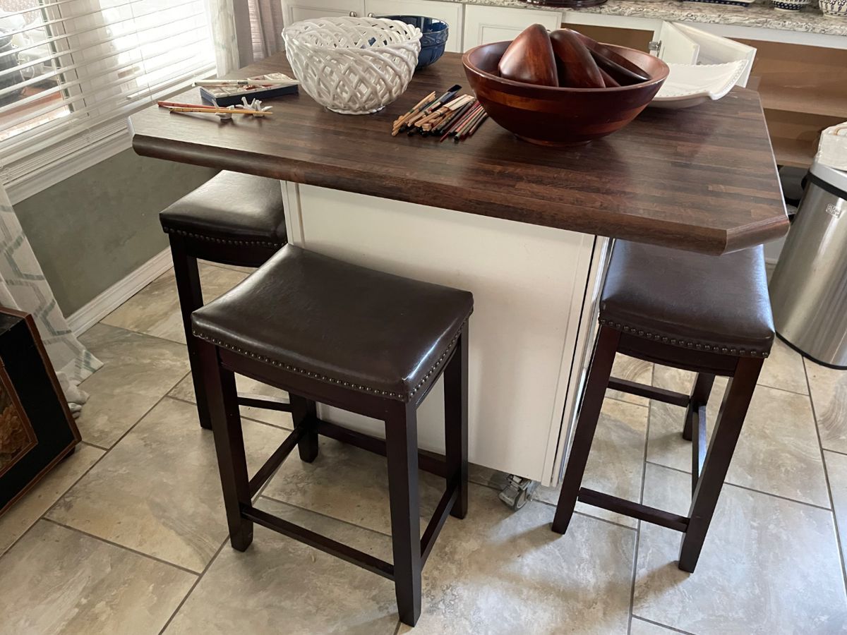 Rolling kitchen island with seating and storage. $350