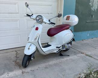 white vespa scooter