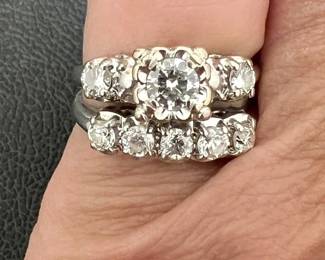 Circa 1940s-50s size 5 combined diamond engagement and wedding band. Center stone of engagement ring is approx 1/4 ctw; additional stones are approx 1/3 ctw, estimated SI-VS clarity, I color.