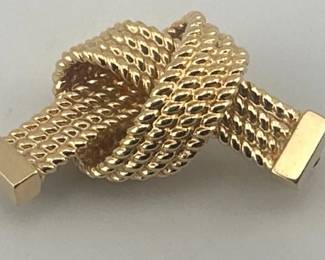 Tiffany and Co. 14kt braided knot pin. Mate to LOT 67. Braided knot is marked 14kt/T and Co. Measures approx. 27mm in width