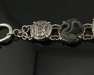 Unusual antique button bracelet is marked 950 silver and signed Barry Brinker; 7"L