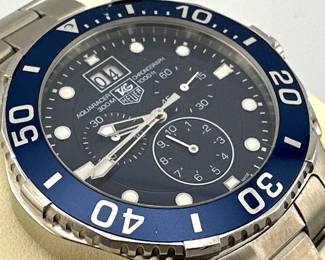 Tag Heuer Aquaracer 300m/1000ft chronograph watch is a working quartz watch with new battery with original box.