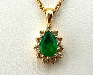 Vintage natural pear shape emerald with diamond halo on 14kt gold chain, in Schwarzschild's box; 15.25"L