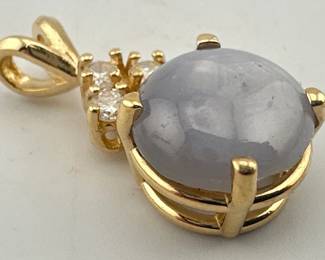 14kt diamond and star sapphire pendant; approx. 1”drop. Round cabochon lavender sapphire has three diamond mounting, I clarity, H color. One diamond is fracture filled