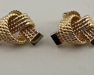 Pair of Tiffany and Co. 14kt knot earrings; 6.21g. Marked 14kt and TC and backs marked 585 TC. Braided knots measure approx. 20mm in width