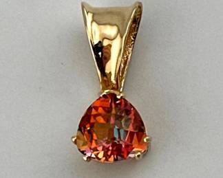 14kt trillion cut 2 carat Mystic Topaz pendant; 0.5”drop. Marked 14kt on bale