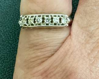 Size 5 white gold band has six diamonds and is marked 14kt
