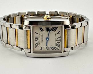 Cartier 18kt gold and steel Francaise tank watch. Cartier Tank Francaise Small Steel Yellow Gold Ladies Watch with quartz movement. Stainless steel case has octagonal 18kt yellow gold crown set with blue spinel cabochon