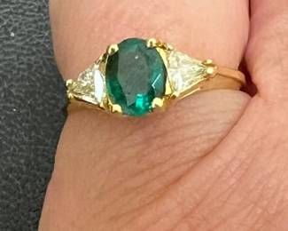 14kt 5 stone natural emerald band with natural diamonds. Oval cut emeralds. Marked 14K/UP, ring size 7