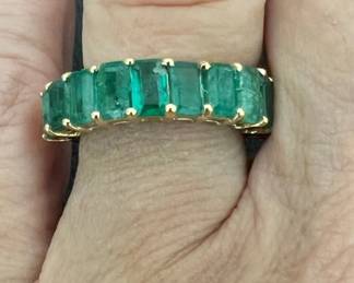 Size 6.5 natural emerald band has 10 emerald cut stones set in 14kt gold