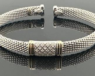 Italian sterling silver flexible mesh bracelet has pave of diamonds with 14kt gold accents; 2.25"Diam