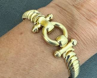 14kt Italian bracelet. Marked CEI/Italy/14K; 6.75”L. 9mm thick crescent shaped links with round latching toggle clasp