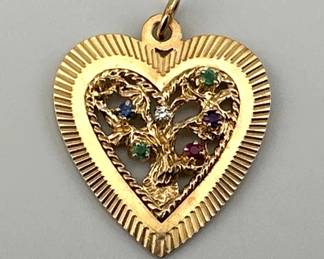Vintage Tiffany heart pendant has open work tree of life set with gemstones diamond, emerald, amethyst, ruby, emerald, sapphire, topaz ("DEAREST"). It is marked Tiffany and Co.; 1.25"W