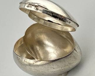 Tiffany and Co. sterling hinged box. Puffy heart shaped hinged box is marked 925/sterling/Tiffany/Italy. Measures 1.5”H