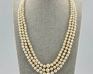 Beautiful pearl necklace has three strands of pearls with 14kt white gold heart shaped clasp with a pave of natural sapphires; pearls are graduated ranging from 3.5mm to 7mm. 15"L