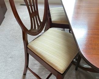 Dining Room Table, one captain's chair, 5 armless chairs, one leaf, pads