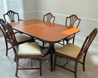 Dining Room Table, one captain's chair, 5 armless chairs, one leaf, pads