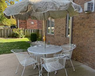 Wrought iron table, 4 chairs, umbrella