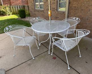 Wrought iron table, 4 chairs, umbrella