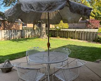 Wrought iron table, 4 chairs, umbrella