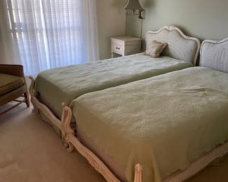Pair of twin French provincial beds with upholstered headboards