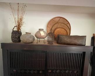 Japanese Tansu cabinet. Purchased in California from Japanese dealer. Pottery and baskets fro around the world.