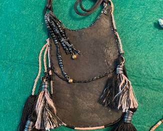 Calf leather cross body pouches with beads and tassels 