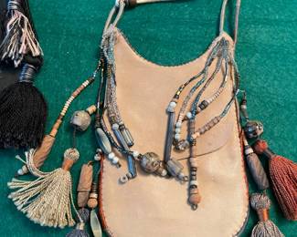 Calf leather cross body pouches with beads and tassels 